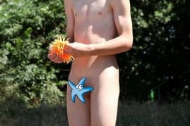 Cute nude boy outdoors
