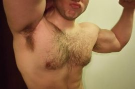 Hairy nude hunk flexing