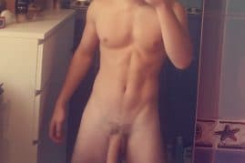 Nude boy taking a selfie