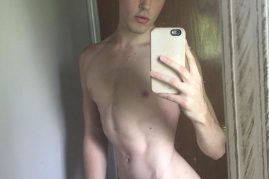 Nude boy taking selfies
