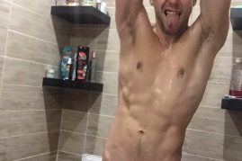 Nude stud taking a shower