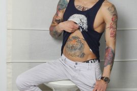 Tattooed boy with a big uncut cock