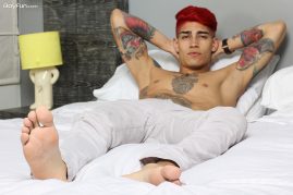 Tattooed boy with a big uncut cock