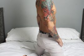 Tattooed boy with a big uncut cock