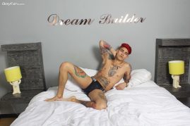 Tattooed boy with a big uncut cock